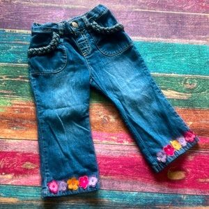 Gymboree girls jeans with braiding and flower details, size 18-24 months